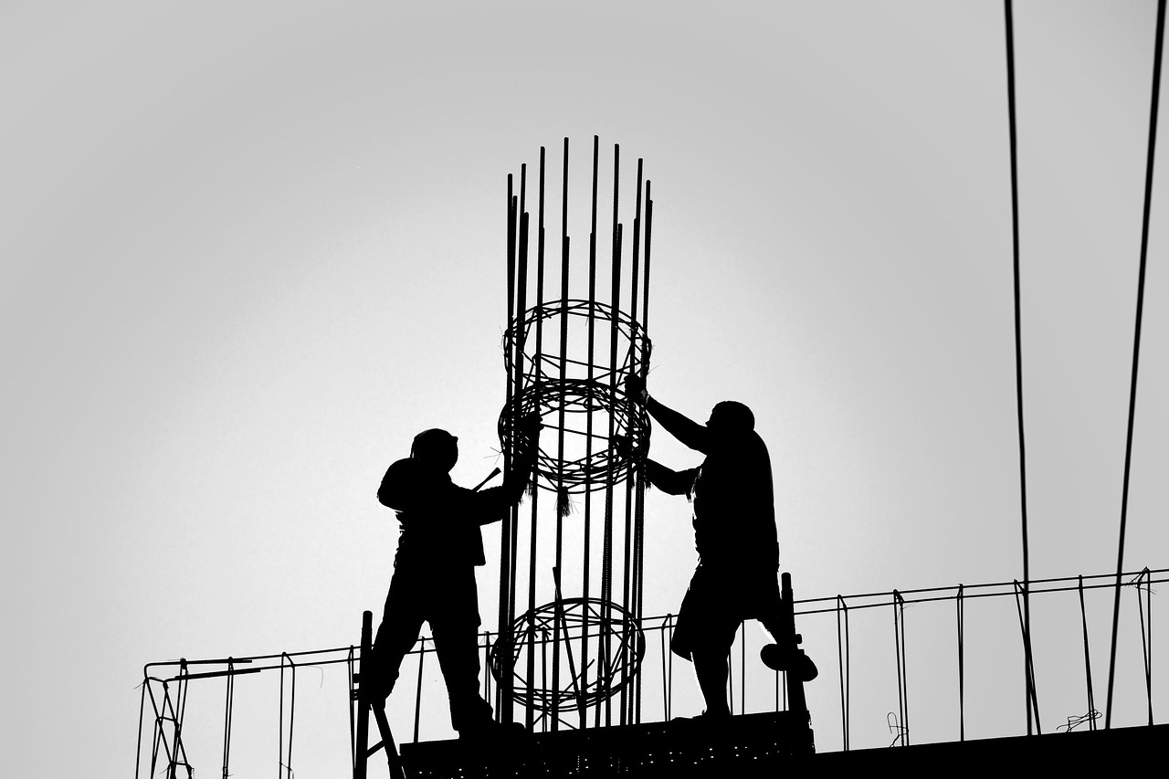 TOL Buildings installation crew assembling a metal building frame on site